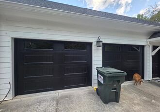 Two black carriage-house doors in Westminster