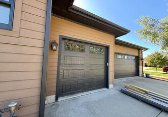 Single carriage-style garage door with windows