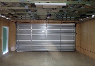 Interior of the new door with tracks and opener rail