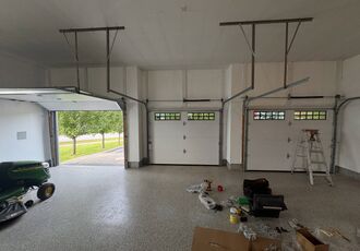 Installation in progress inside the three-car garage